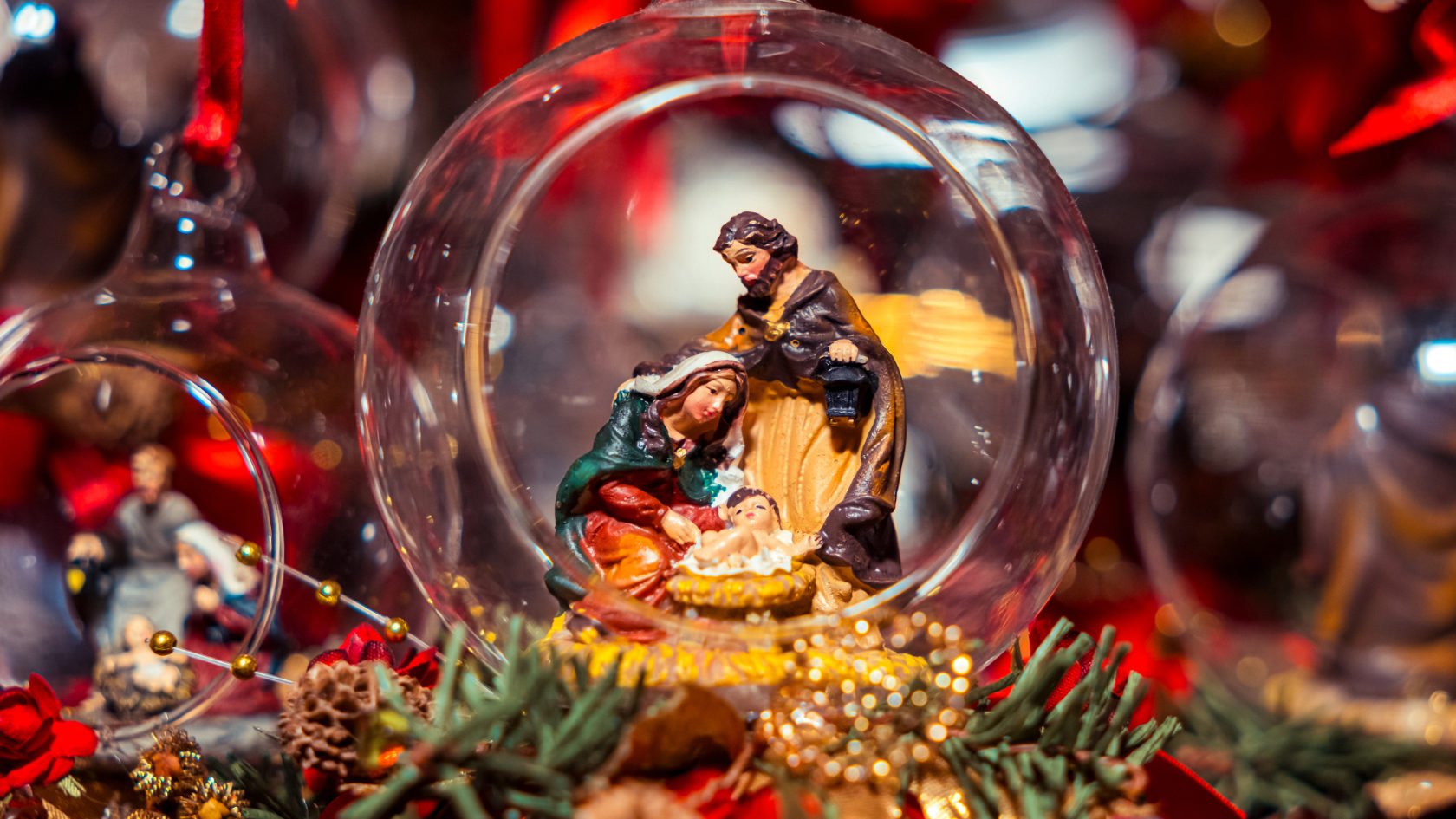 Nativity figures in a glass Christmas bauble