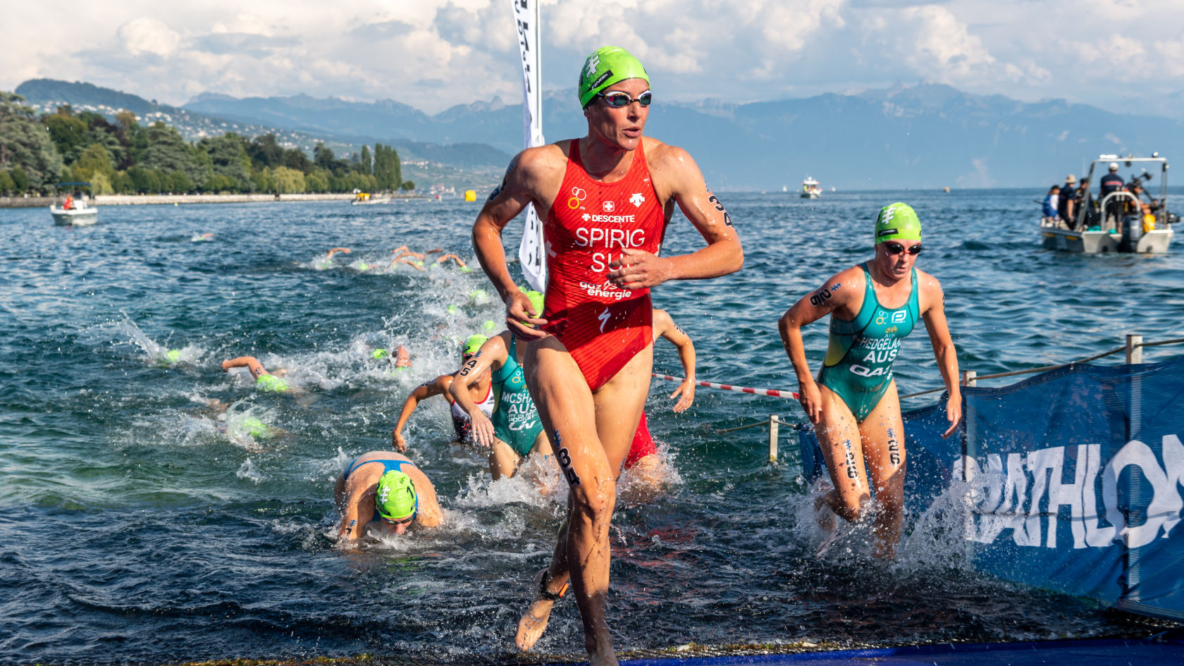 Nicola Spirig runs out of a lake during a race.